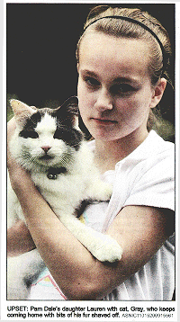 UPSET: Pam Dales's daughter Lauren with cat,Gray,who keeps coming home with bits of his fur shaved off. [ASNIC11015200915561]