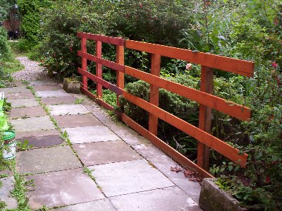 The second fence panel goes in prior to being repainted green.
